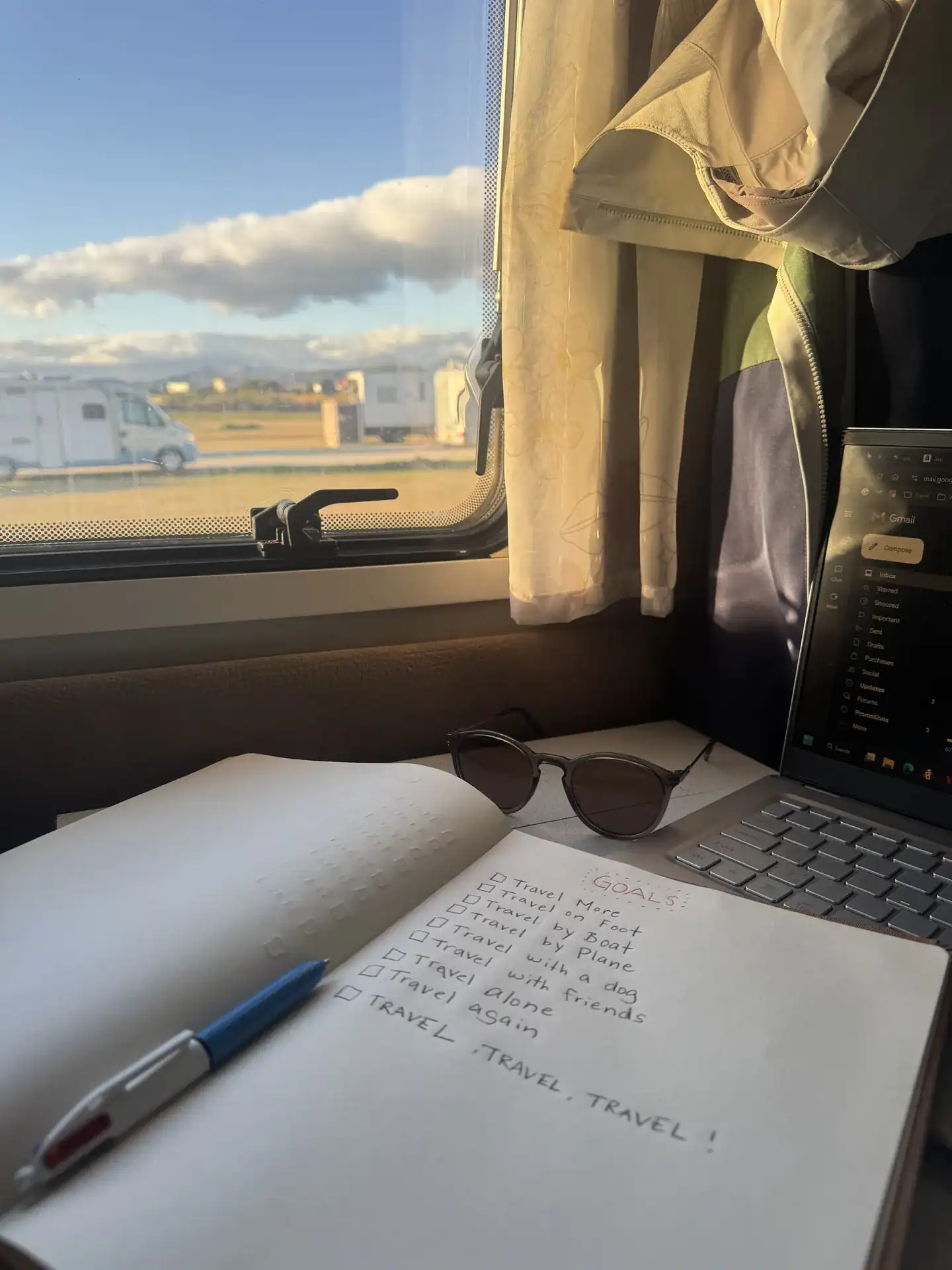 Travel journal with a view from a motorhome